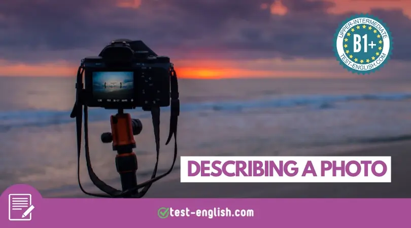 A digital camera on a tripod capturing a vibrant sunset over a calm beach, used for an upper-intermediate ESL writing lesson on describing photos.